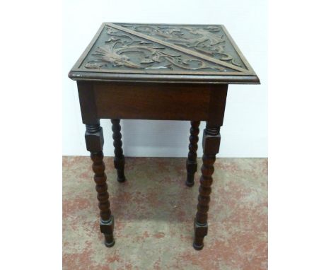 Late 19th century Scottish oak handkerchief corner table, with carved mythical creatures to the top and drop side, on block a