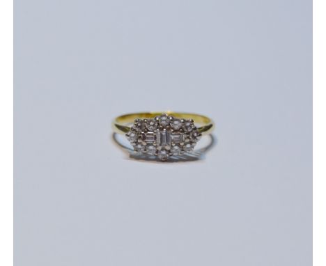 Diamond oval cluster ring set with baguettes and brilliants, 18ct gold, size R, 3.4g gross. 