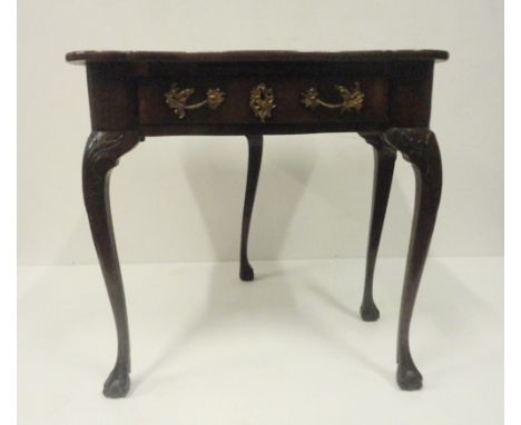George II style mahogany fold-over card table, on twin gate supports with central drawer, on ball and claw feet, 75cm high, 7