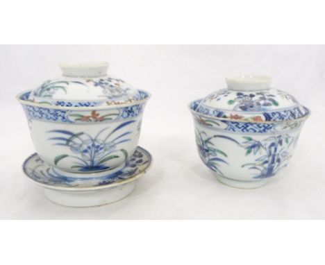 Two near-matching Chinese porcelain rice bowls with associated covers, (probably Qing Dynasty), hand-painted with butterfly l