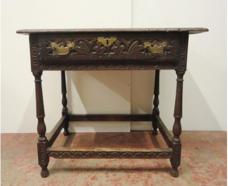 18th century oak side table with incised mouldings to the table top and frieze, iron lock to the drawer interior, on turned c
