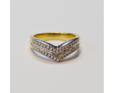 Diamond half eternity-style wishbone ring with a wavy chevron of baguettes and brilliants, in 18ct gold, size R, 9g gross. 