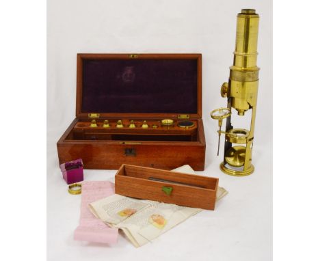 19th century field barrel brass microscope, unsigned, with accessories and related paperwork, in a fitted mahogany case, 5.5c