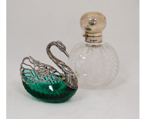 Silver-mounted open salt dish in the form of a swan, the wings opening to reveal the green glass basin, decorated with putti,