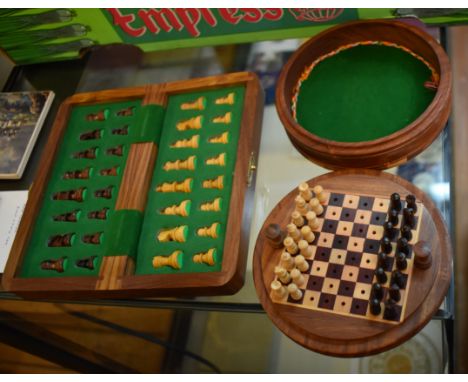 Pair of small carved wooden travel chess sets. Nice find. Both complete