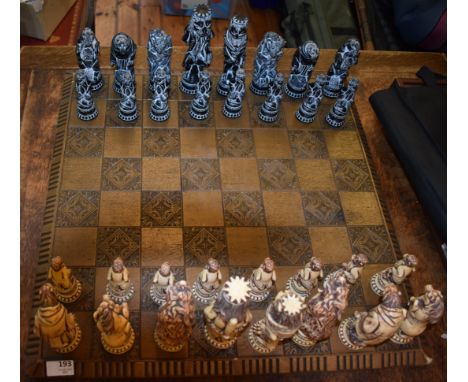 Large animal kingdom moulded chess set. Complete with carved style playing base. Used condition