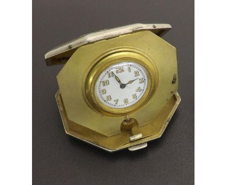 Silver cased octagonal compact travel watch, the gilt interior with a circular white dial with Arabic numerals, Birmingham 19