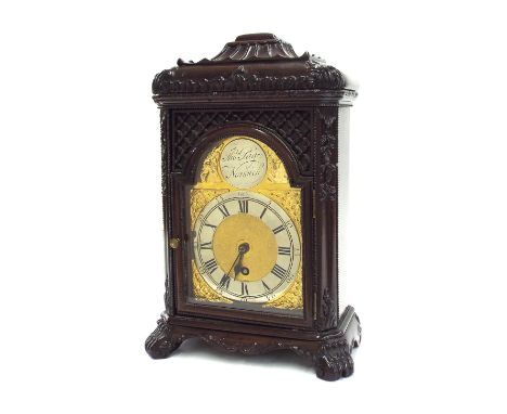 Chinese type stained hardwood mantel clock timepiece, the movement stamped Newbridge Works, Bath, the 4.75" brass arched dial
