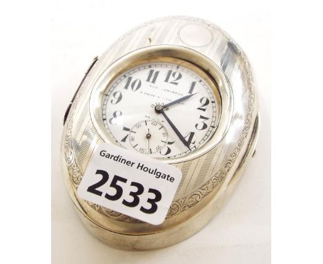 Silver engine turned oval pocket watch case, enclosing a nickel cased eight day lever pocket watch, the dial signed S. Smith 