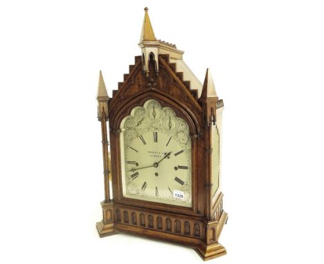 Good large oak triple fusee Gothic boardroom clock, the substantial movement with pull repeat playing on a nest of eight bell