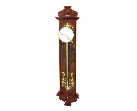 Reproduction gravity wall clock, the 4" dial within a drumhead surround upon a lacquered wooden back board, 31" high 