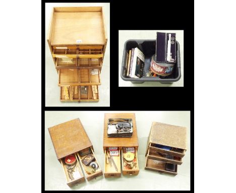 Wooden watch/clockmakers nest of drawers containing various accessories, 23" high; together with two oak chests, four drawer 