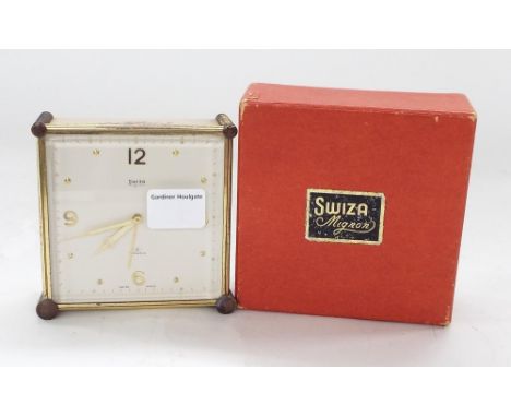 Swiza Mignon eight jewel travelling alarm clock, the 3.5" square dial within a cream case decorated with flowers, original bo