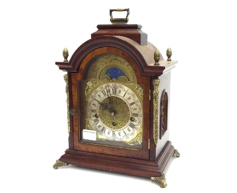 Contemporary burr walnut three train bracket clock, the Franz Hermle movement striking on five rods, the 5.5" brass arched di