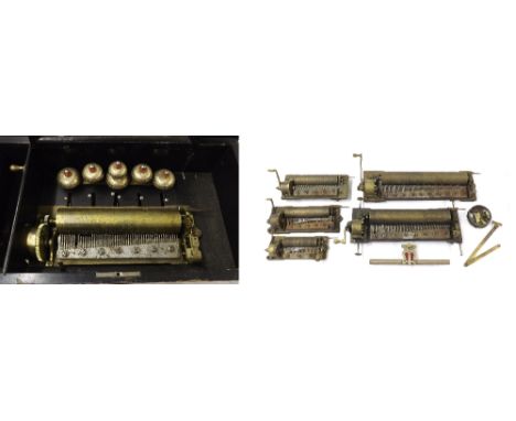 Rosewood and walnut crossbanded music box in need of restoration, the 9" cylinder playing on six bells, within a foliate inla