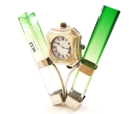 Interesting silver plated wall pocket watch, the eight day nickel lever Goliath pocket watch within a cushioned shield surrou