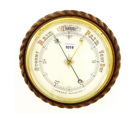 Large circular wall aneroid barometer, the 10" cream dial within a rope twist surround