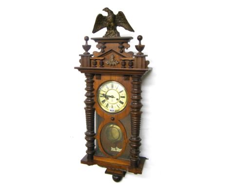 Walnut Gustav Becker two train spring driven Vienna wall clock, the 6" dial bearing the maker's logo within a pillared glazed