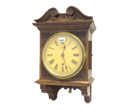 Oak single train hooded wall clock with W.H. movement, the 7.75" cream dial within a carved case surmounted by a swan neck pe