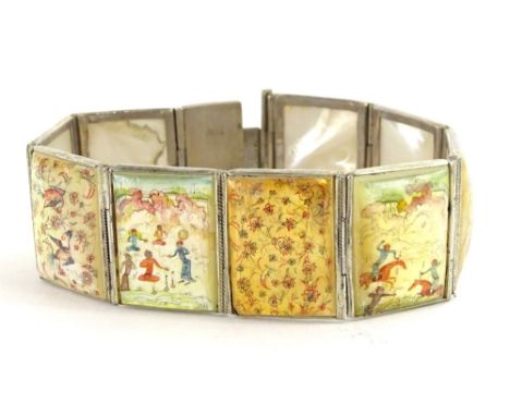 An Oriental style bracelet, with nine painted mother of pearl rectangular panels, depicting birds, flowers and figures, in wh