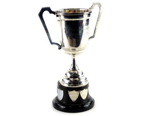 A silver two handled trophy, the Bracebridge Heath Hospital cup on domed base, with black plastic plinth engraved with variou