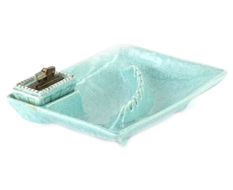 An American pottery ashtray, with mottled pale blue glaze, and matching lighter, incised marks to underside, 24cm W.