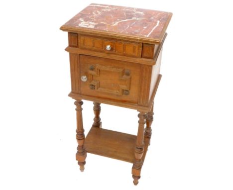 A French oak pot cupboard, the rectangular top with a rouge marble inset above a frieze drawer and a raised panel door, on tu