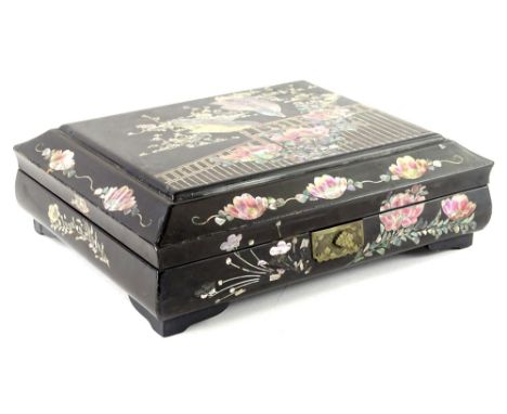 A black lacquer and mother of pearl oriental style workbox, and various mother of pearl gaming counters to include fish etc.,