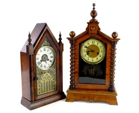 Two American mantle clocks, to include a veneer example with Gothic style verre eglomise glass panel to the door etc. 27cm H,