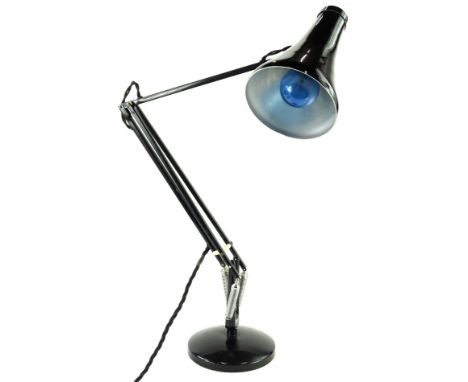 A black painted anglepoise type lamp, with a weighted base.