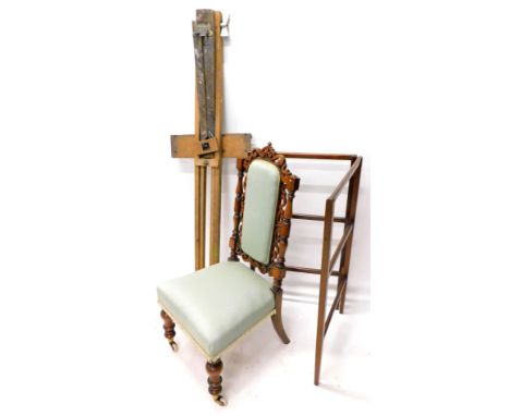 A Victorian walnut nursing chair, the pierced back with turned supports, with a padded seat on turned tapering legs with cera