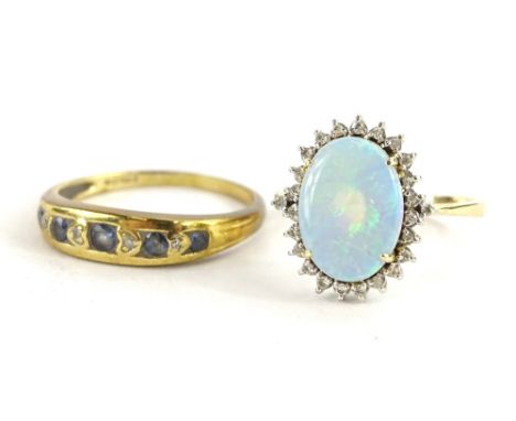 Two dress rings, to include an opal and diamond ring, with oval cut opal surrounded by tiny diamonds, yellow metal, marked 58