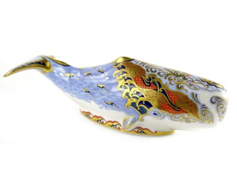 A Royal Crown Derby porcelain oceanic whale porcelain paperweight, decorated in Imari colours, printed mark to underside, and