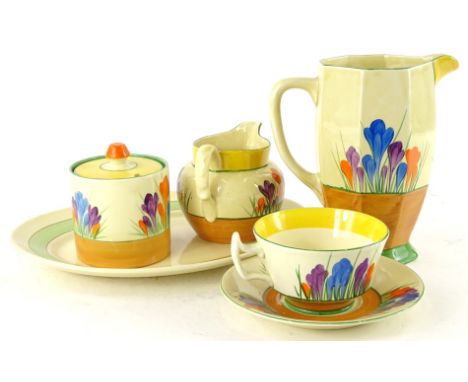 A collection of Clarice Cliff pottery, to include crocus pattern jug, cup and saucer, small jug and preserve jar and cover an