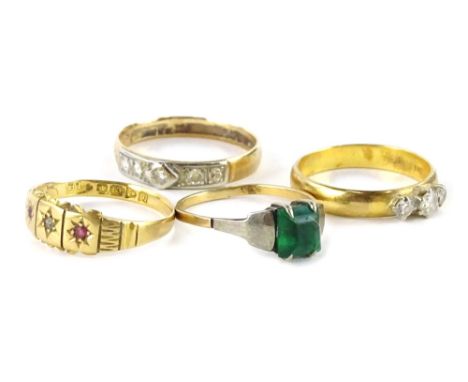 Four various rings, comprising a dress ring set with three CZ stones, gold coloured, but marked 900, a Victorian 18ct gold dr