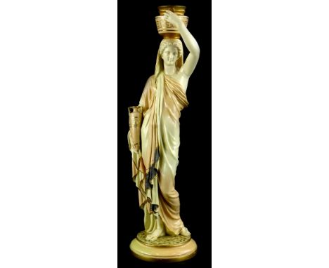A Royal Worcester porcelain figure, of a female water carrier modelled with a gold two handled vessel on her head, carrying a