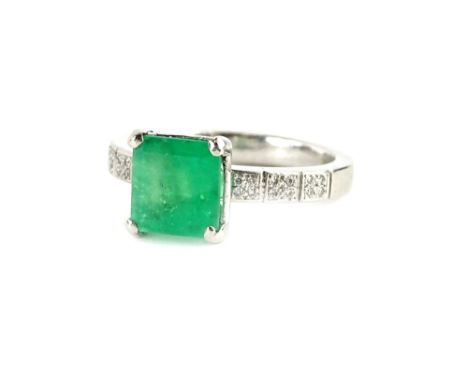A platinum emerald and diamond ring, with central square cut emerald, in claw setting, approx 1.81cts, with tiny diamond set 