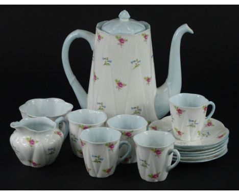 A Shelley part tea service, printed with pink and blue flowers, on a cream ground with blue handles interiors etc., pattern n