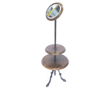 A Victorian walnut and brass shaving stand, with a circular bevelled mirror plate, with brass bezel on a cylindrical column, 