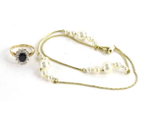 Two items of jewellery, to include a 9ct gold dress ring, set with CZ stones, and a gold plated faux pearl necklace. (2)