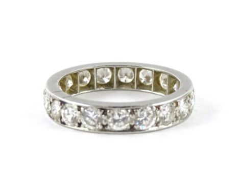 A diamond eternity ring, set with nineteen round brilliant cut diamonds, each in claw setting, approx 0.05cts each, total est