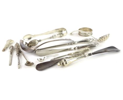 A collection of small silver, to include ladle, sifter spoon, sugar tongs, shoe horns, etc. 