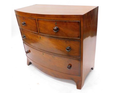 An early 19thC mahogany bow fronted chest of drawers, the caddy shaped top with a cross banded and boxwood strung border, abo