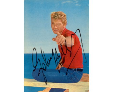 HALLYDAY JOHNNY: (1943-2017) French Rock´n Roll Singer. Rare and excellent vintage signed colour postcard photograph, the ima