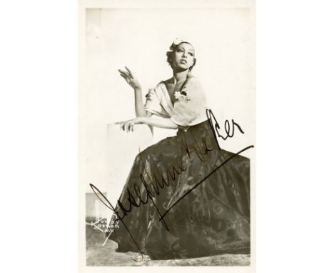 BAKER JOSEPHINE: (1906-1975) African-American Dancer and Singer. A good vintage signed postcard photograph of Baker, the imag