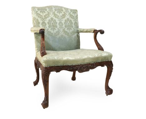 A George II Mahogany Gainsborough-Type Library Armchair, mid 18th century, upholstered in light blue silk damask, the padded 