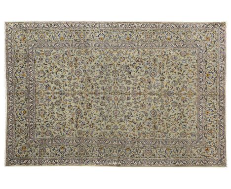 Kashan CarpetCentral Iran, circa 1970The field with an allover design of scrolling vines enclosed by borders of palmettes and