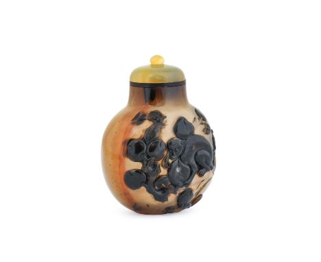 A Chinese Carved Cameo Agate Snuff Bottle, perhaps Suzhu, circa 1750-1850, of flattened ovoid form, carved in relief utilisin