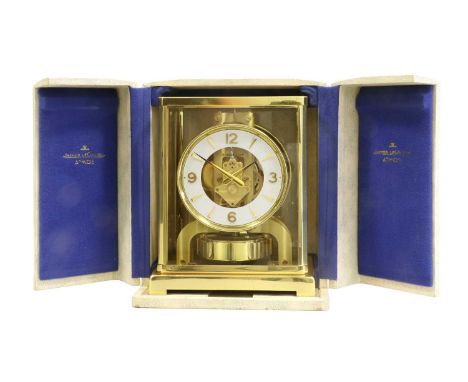 A Brass Atmos Clock, signed Jaeger LeCoultre, 20th Century, case with five glass panels, stop/start lever above the balance w