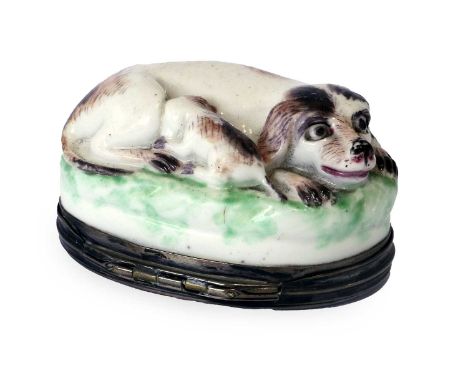 A Silver-Mounted Mennecy Porcelain Snuff Box, circa 1750, naturalistically modelled and painted as a dog and puppy recumbent 